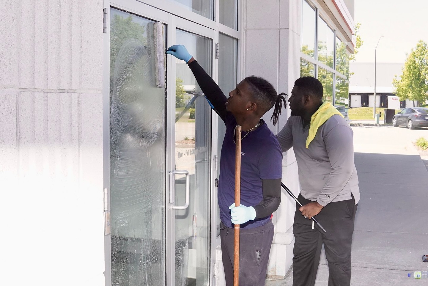 Professional window cleaning service in action.